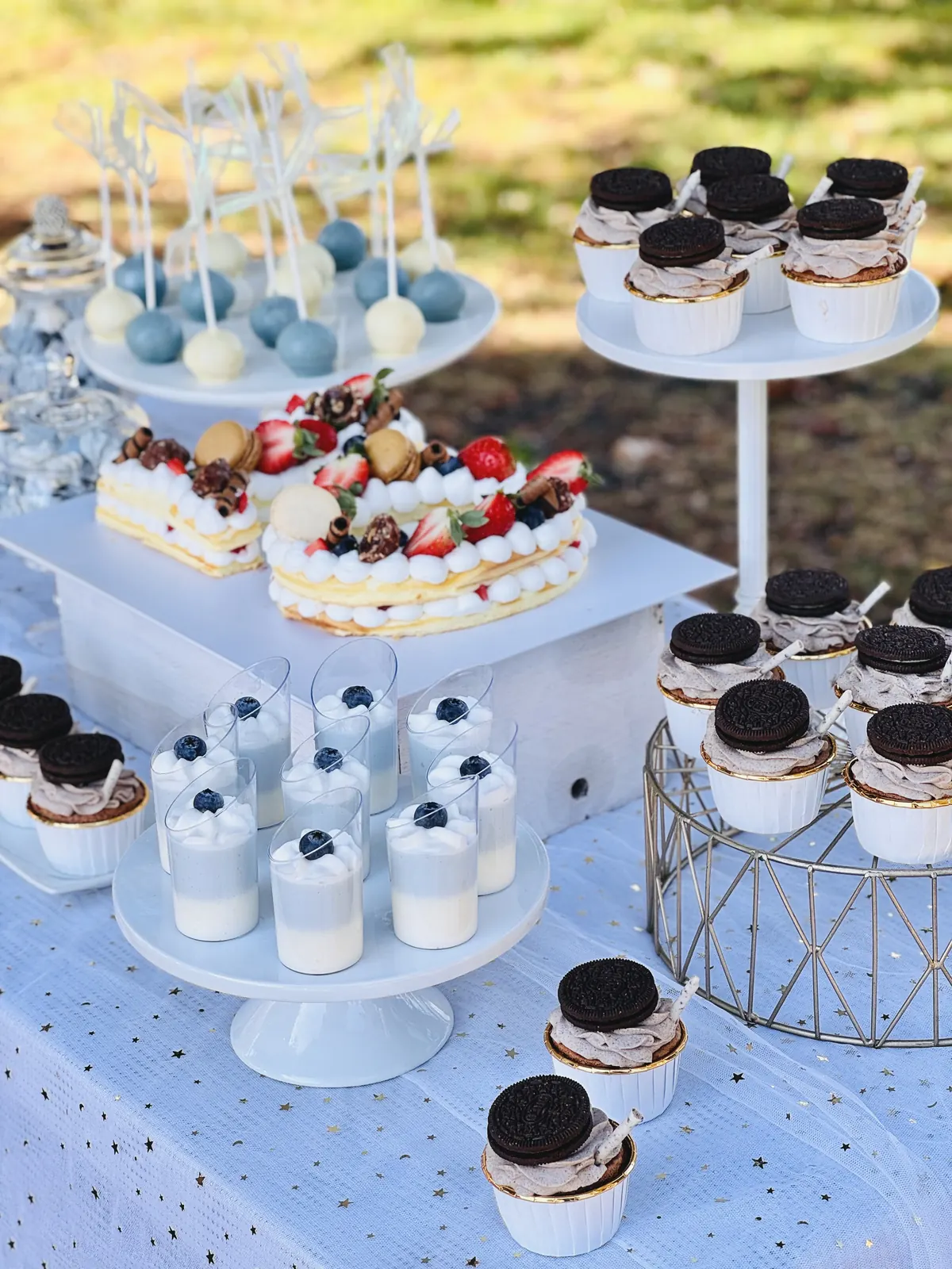 Blue and white dessert tower with cookies-and-cream cups