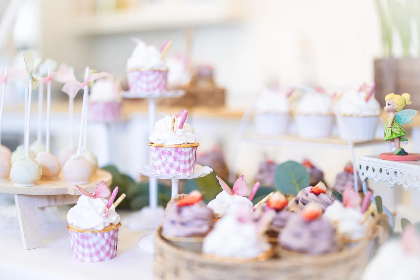Decorated cupcakes and sweets in soft focus
