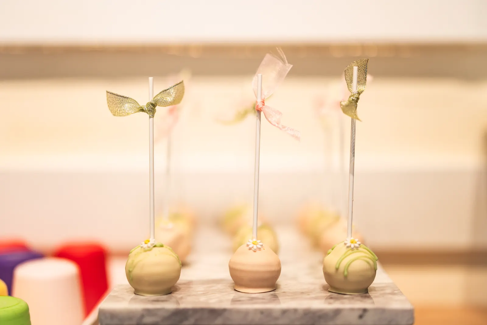 Cake pops tied with ribbon bows