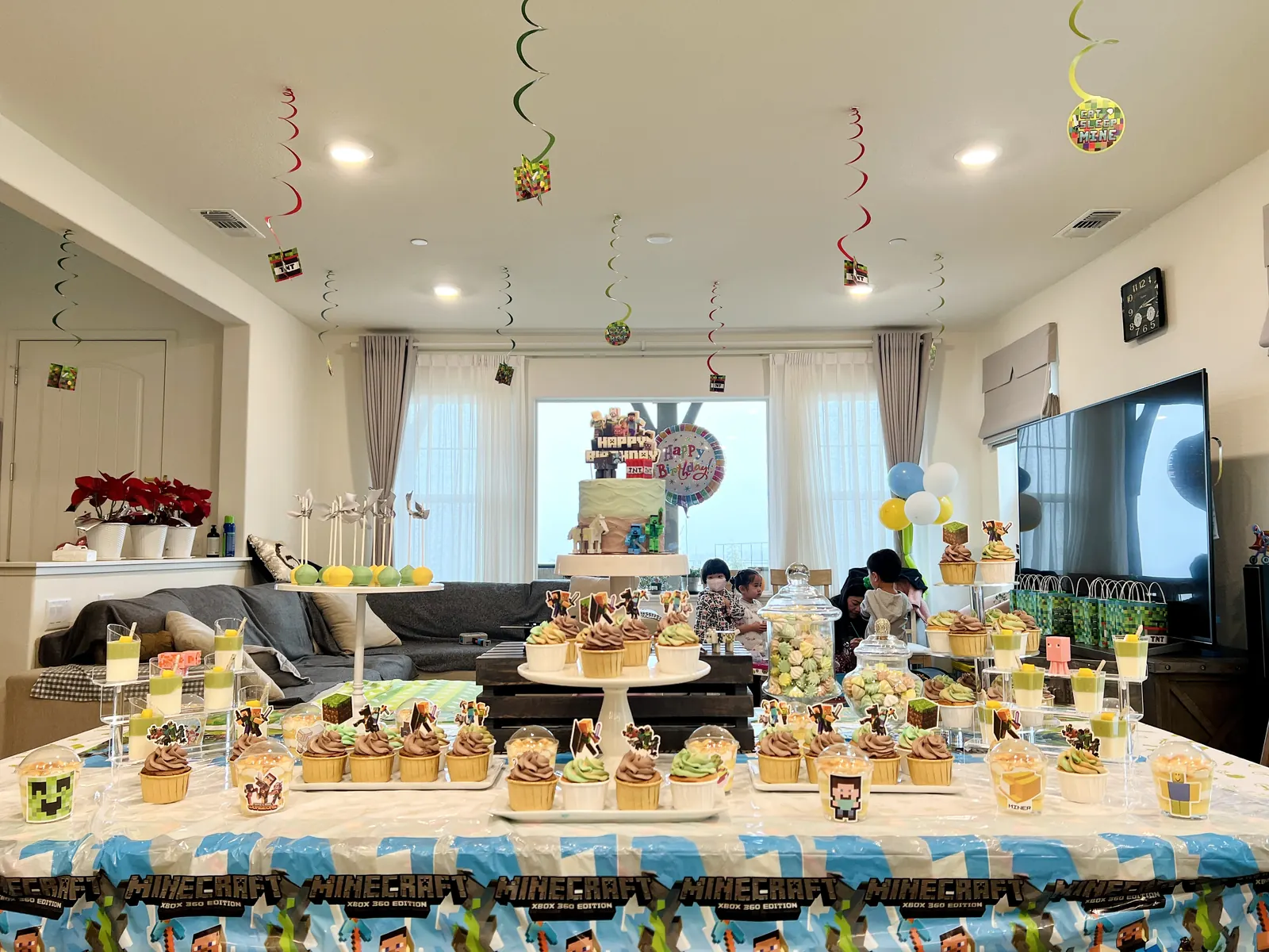 Large party dessert table in a decorated living room
